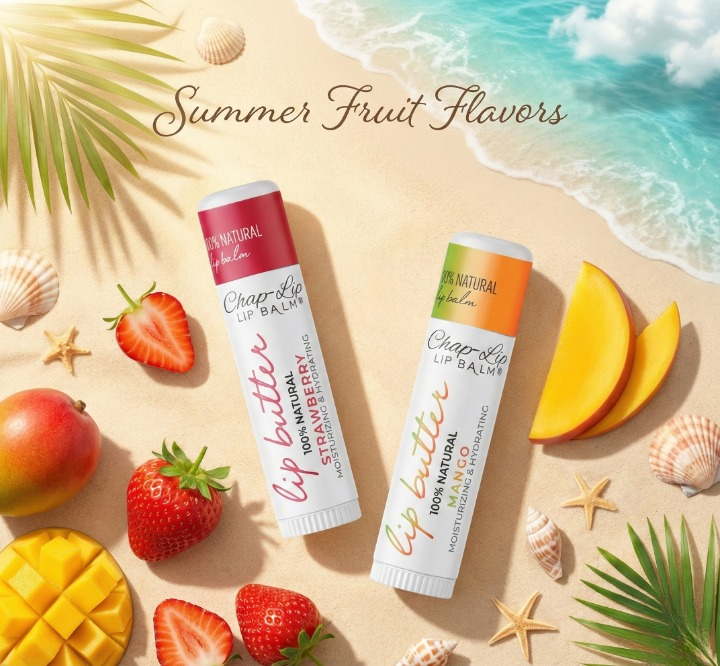 Two ChapStick lip balms on a beach with fruits and ocean view